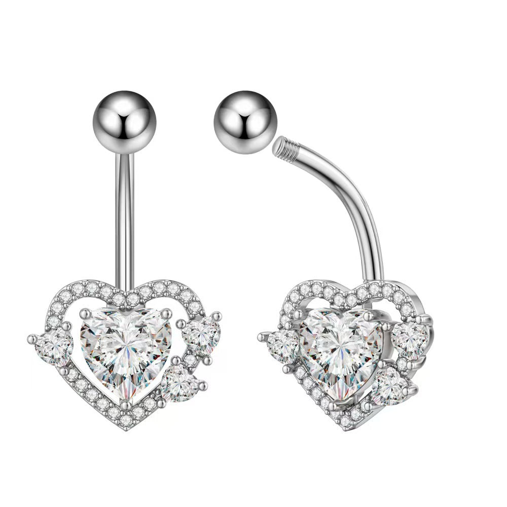 Close-up showing the elegant structure and top ball of the heart navel ring.