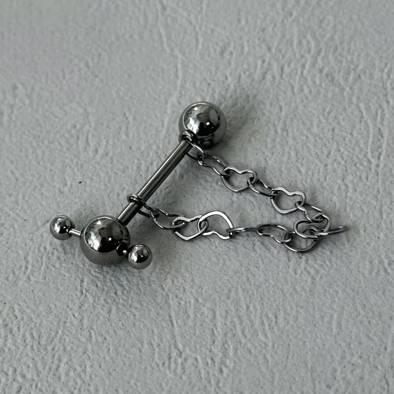 Assembled heart chain cross tongue barbell jewelry flat lay
