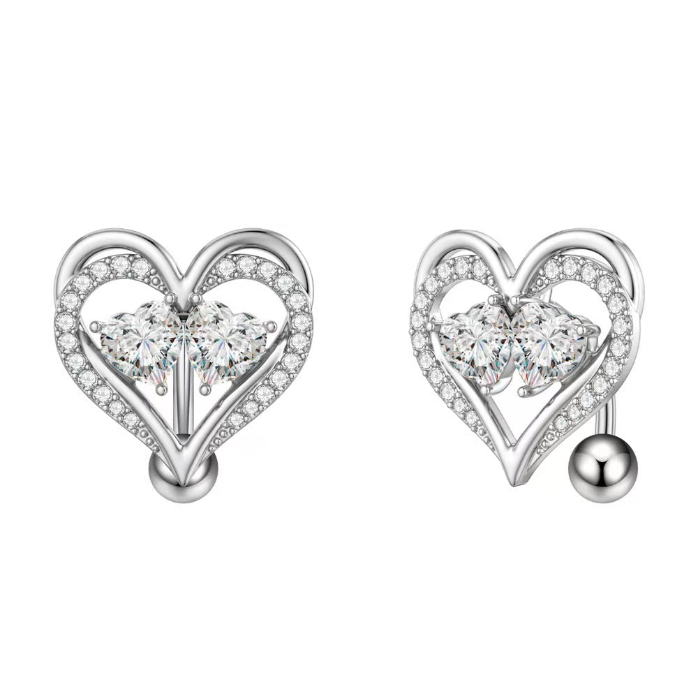 Detailed views of the heart-shaped navel jewelry showing the stone setting and curved barbell design.