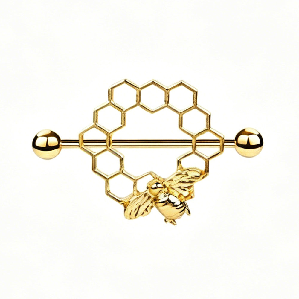 Detailed front view of a gold-toned hexagon honeycomb nipple shield with a small 3D bee charm.