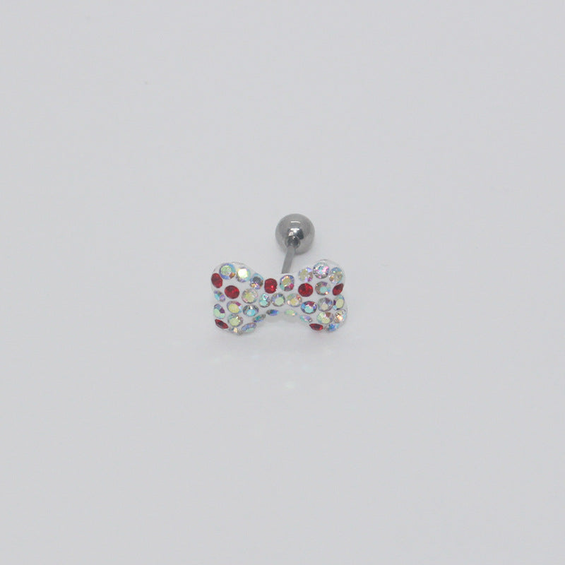 One iridescent rhinestone bow earring with scattered red accents, a short post and silver-tone ball end.