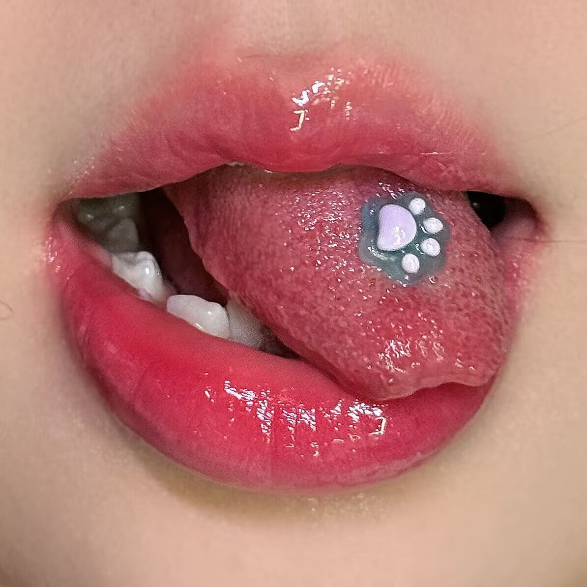 Trendy lavender purple resin cat paw tongue piercing stud in mouth, cute pastel body jewelry accent