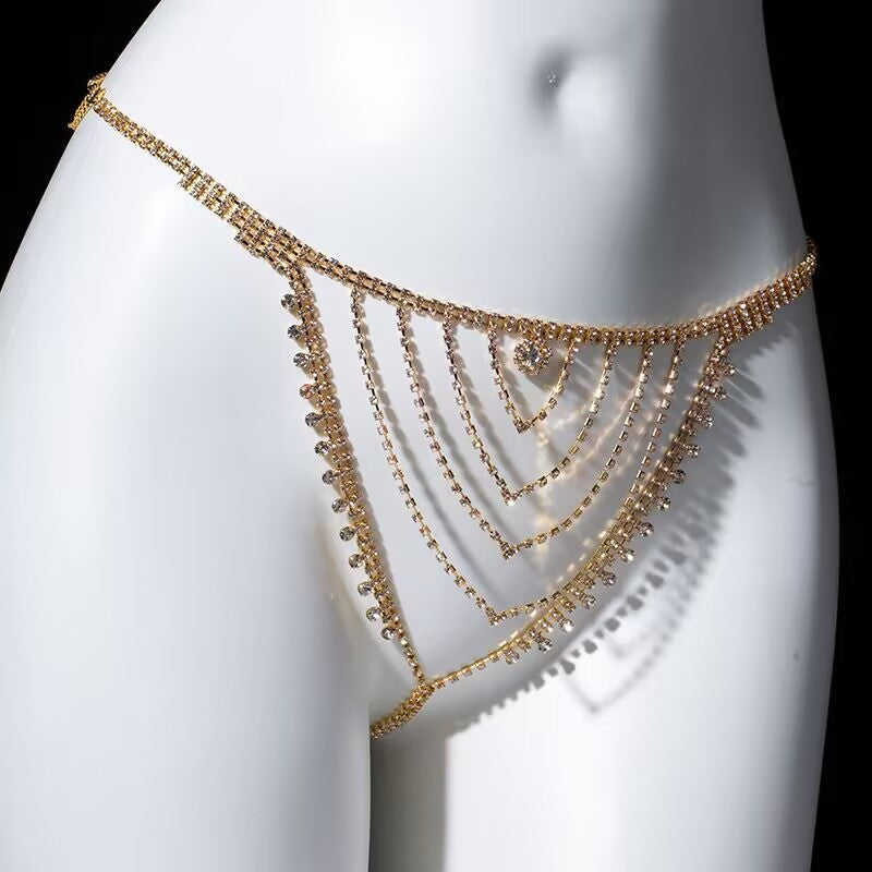Close-up of gold layered V-shape rhinestone thong waist chain showing sparkly crystal details and adjustable straps.