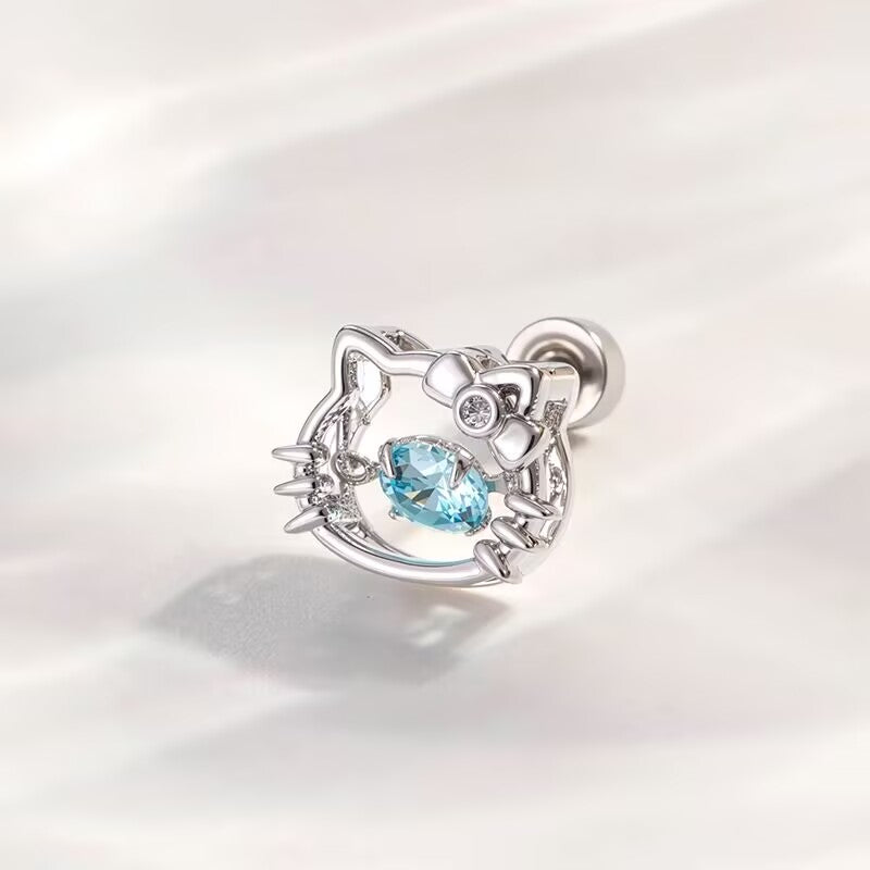 Light blue floating gemstone kitty flat back piercing stud showing bow detail and polished finish