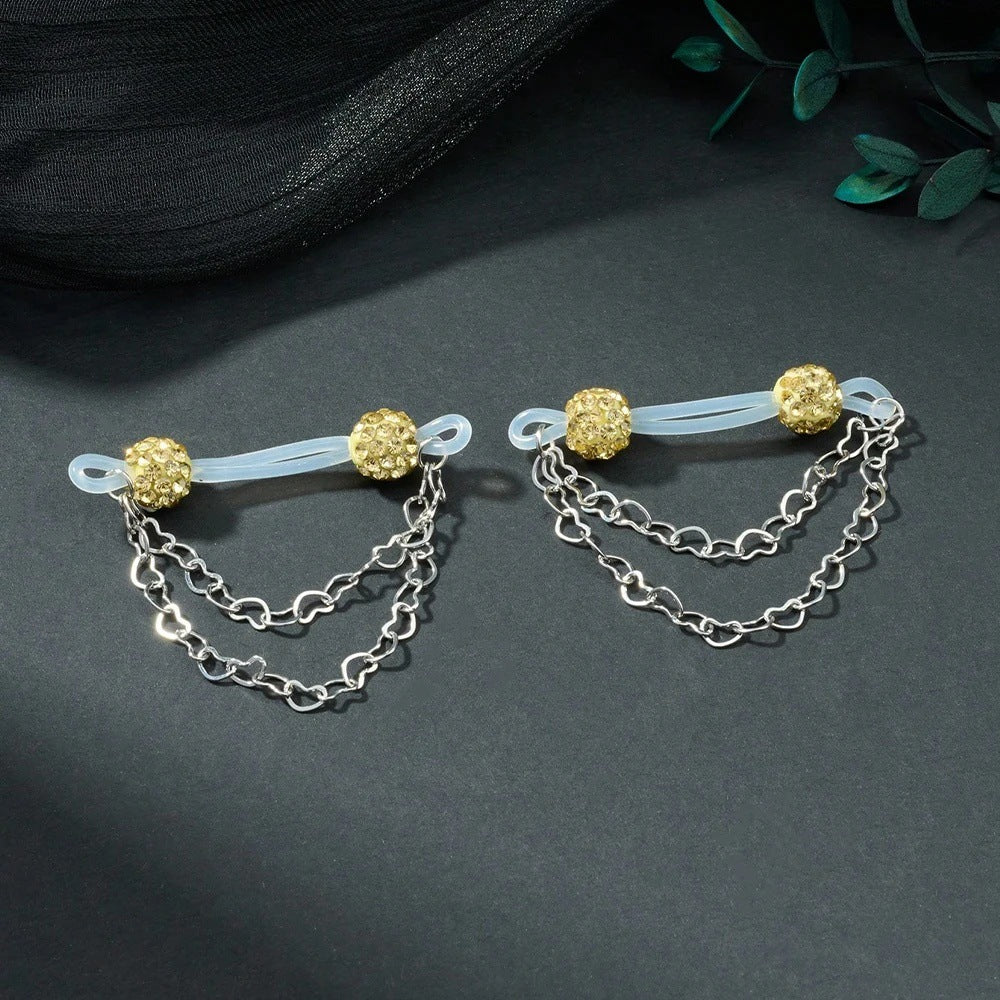 Pair of light yellow sparkling-ball non-piercing nipple jewelry with translucent loops and heart chains