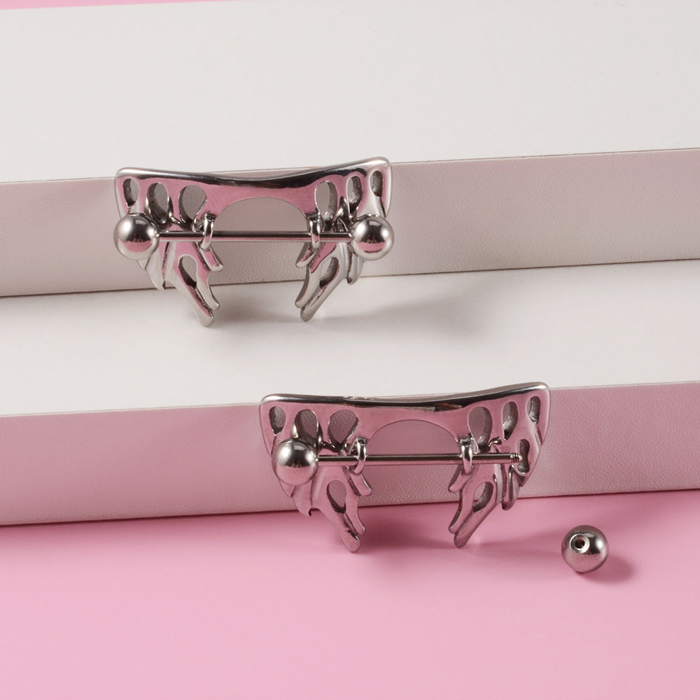 High-angle shot of two silver molten-style nipple shields with one end-ball detached to show the screw-on mechanism.