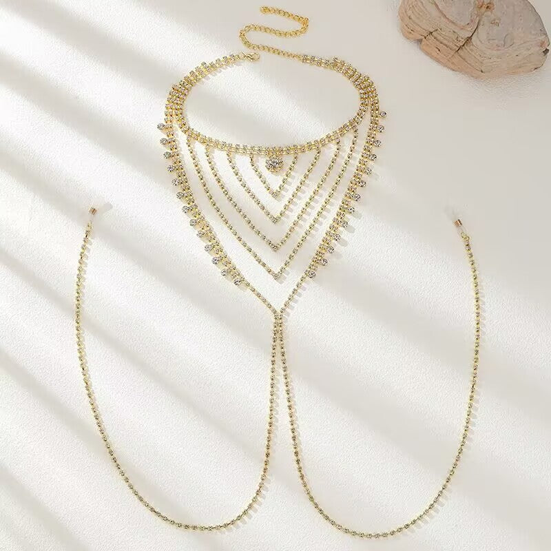 Flat lay shot of a luxury gold layered rhinestone chest harness nipple chain with adjustable clasp.