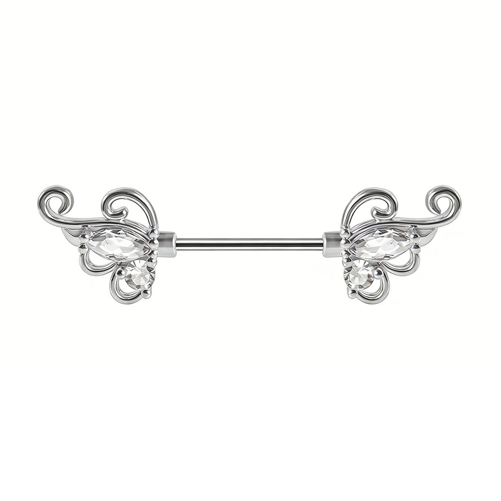 Front view of a silver-tone nipple shield with ornate vintage scrollwork and crystals.