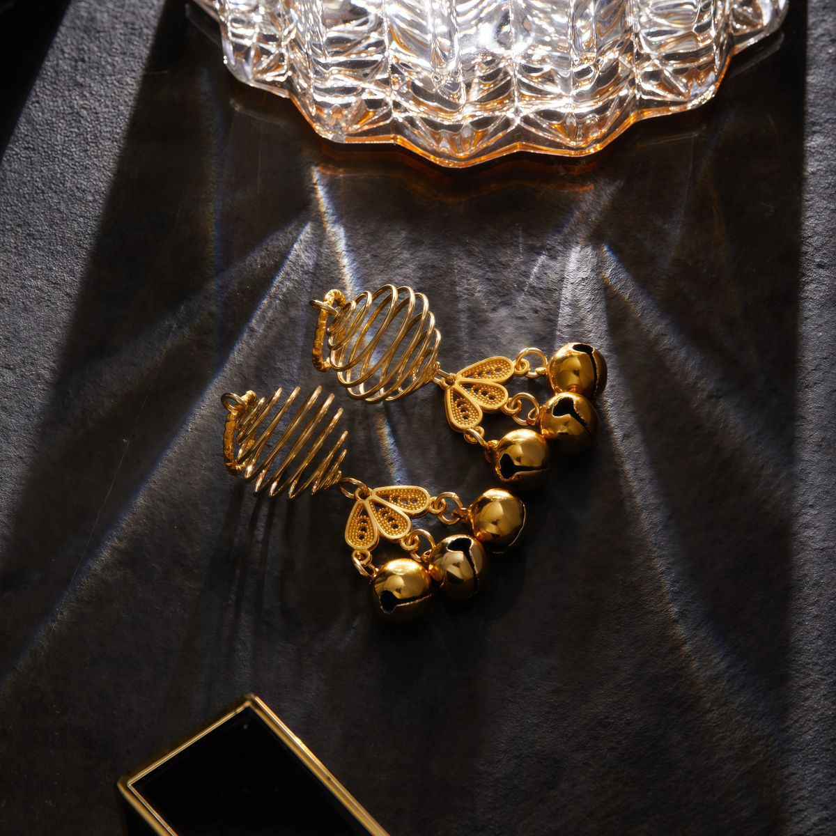 Non-piercing nipple clamps with mini gold bells that create a subtle chime.