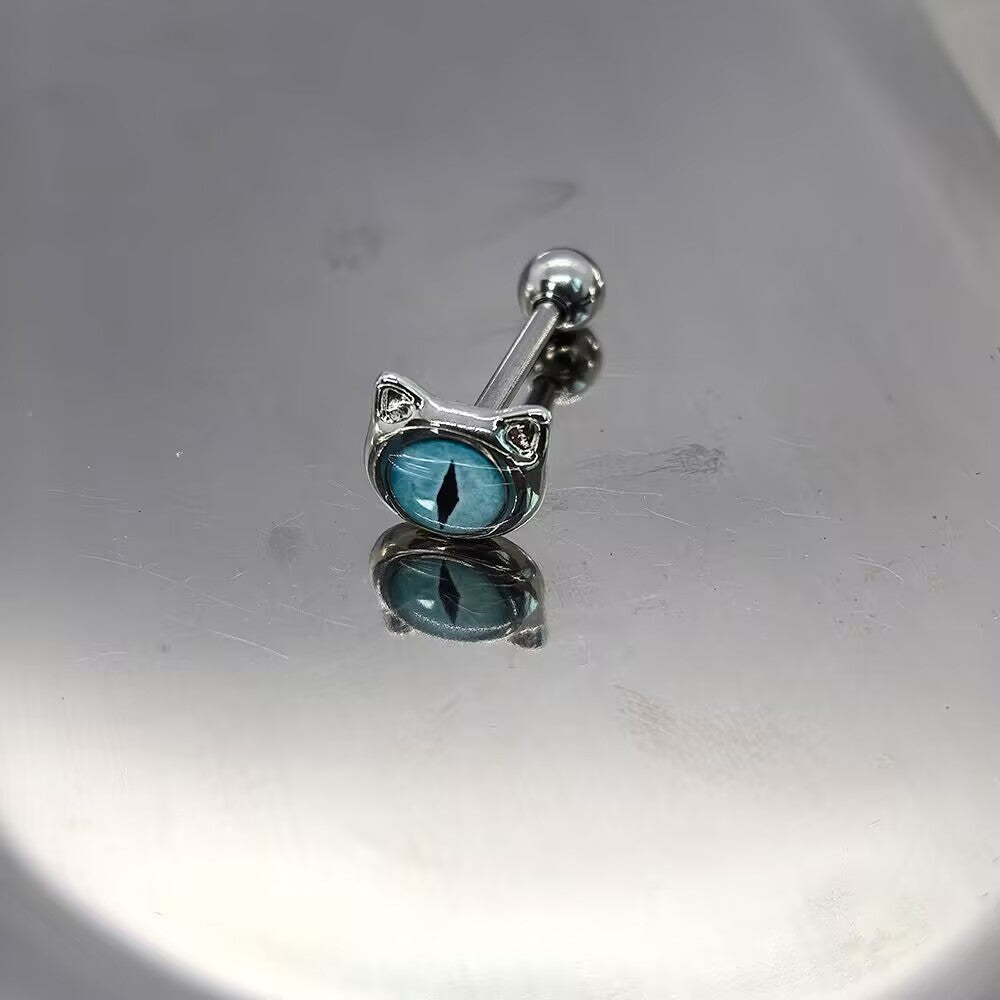 Mystic blue cat eye tongue barbell stud angled to highlight the intricate pupil cabochon details.