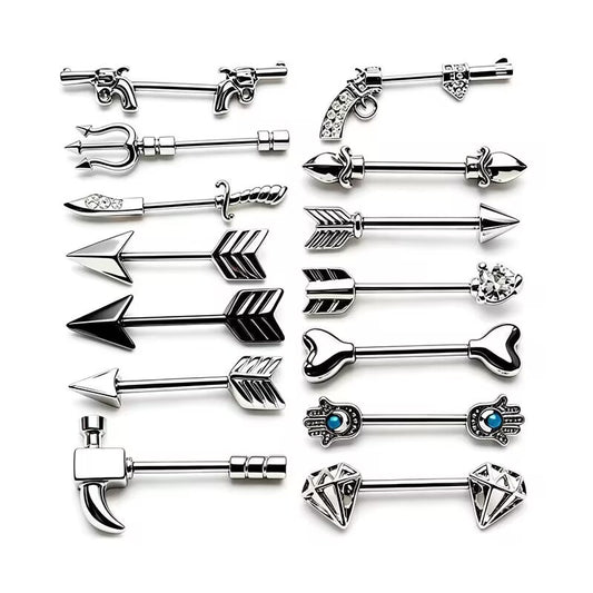 Multi-style nipple barbells set featuring arrow, pistol, sword, key, hamsa hand, and diamond designs.