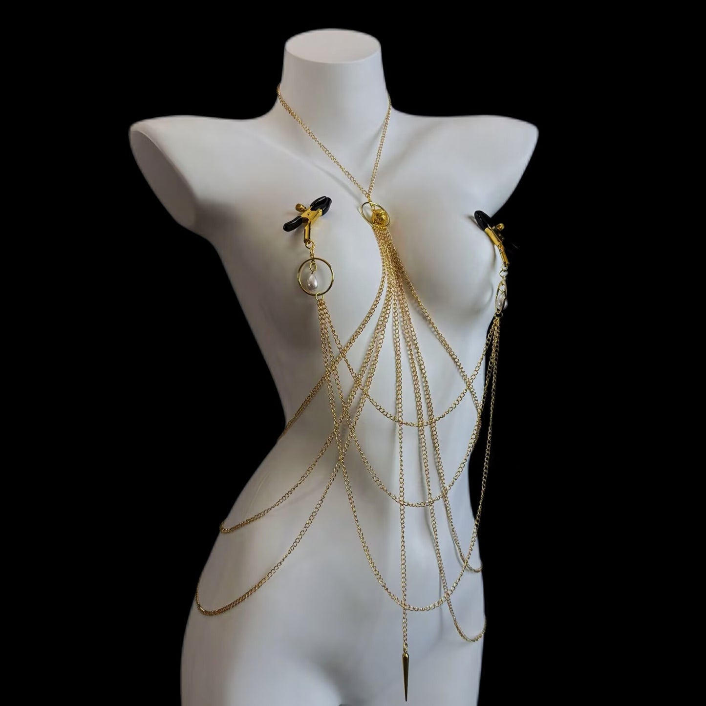 Non-pierced nipple clamp body chain set with gold layered chains and rubber-tipped clips on white mannequin