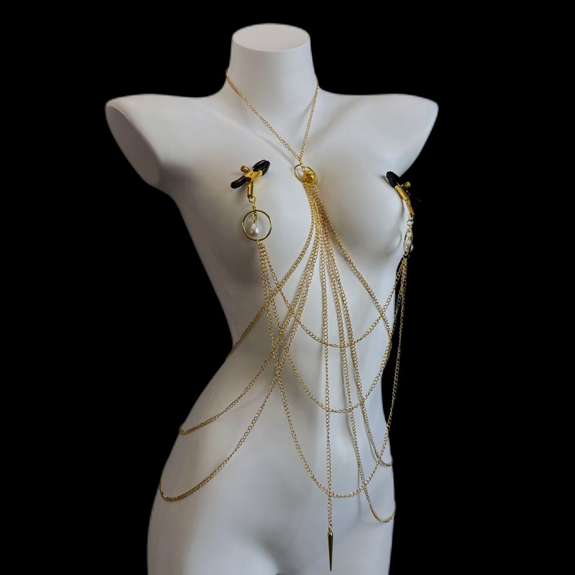 Non-pierced nipple clamp body chain set with gold layered chains and rubber-tipped clips on white mannequin