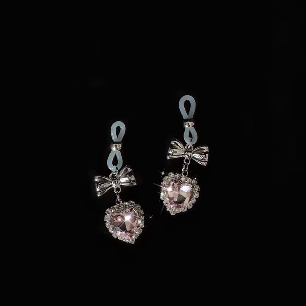 Pair of non pierced nipple rings with soft silicone loops and bow pink heart charms.