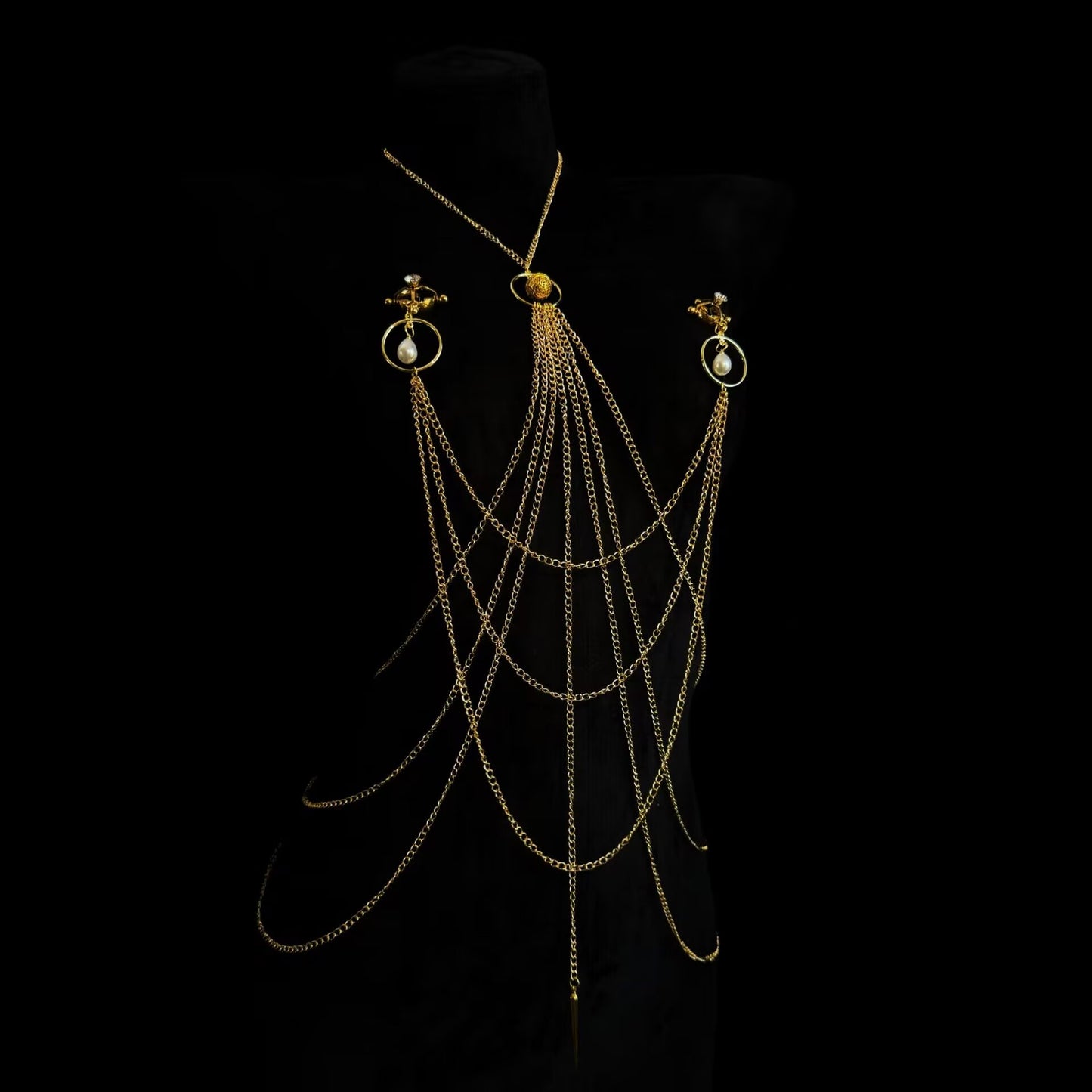 Non-pierced screw-on clip body chain harness in polished gold displayed on black backdrop