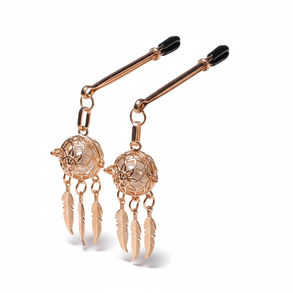 Two gold-tone non-piercing dreamcatcher nipple rings with protective soft tips