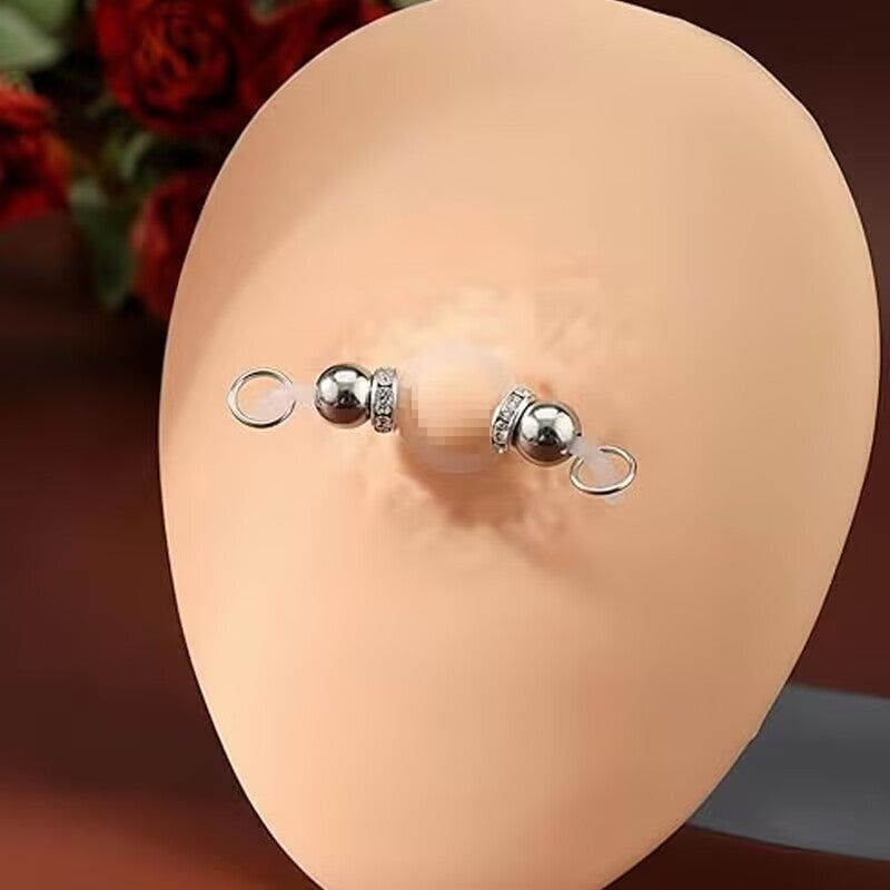 Close-up demonstration of a non piercing fake nipple ring with flexible silicone rod on a display model.