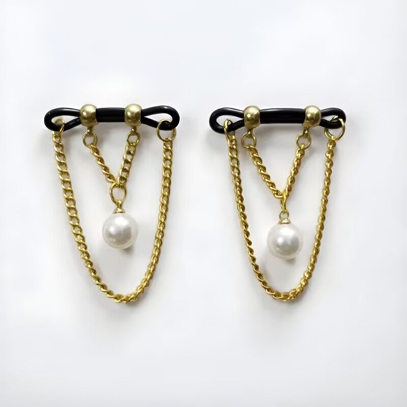 Non-piercing nipple clamps featuring classic white faux pearl pendants and elegant gold dangle chains.