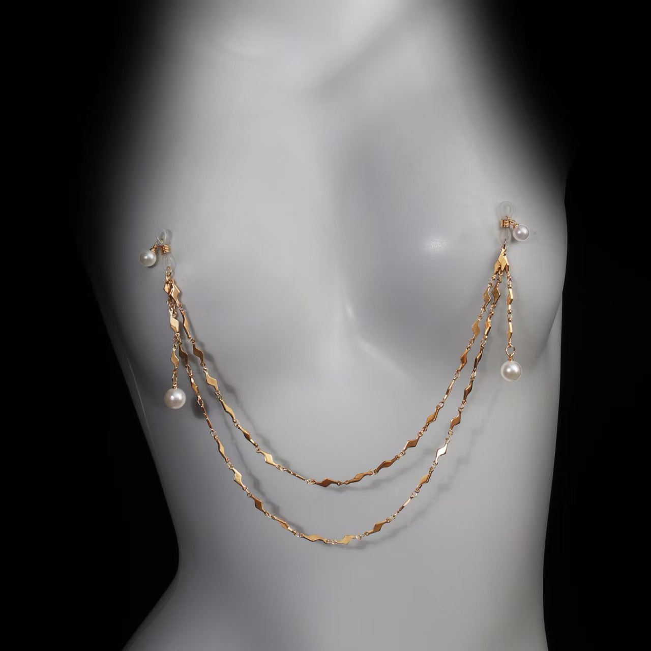 Front perspective of the adjustable non-piercing pearl body harness chain on a female mannequin silhouette, showcasing aesthetic clothing placement.