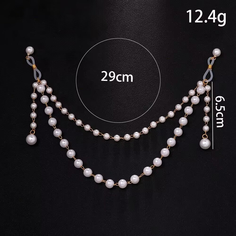 Flat lay of the non-piercing pearl nipple body chain on a black background, with text labels showing product specifications: 12.4g weight, 29cm chain length, and 6.5cm pearl tassel.