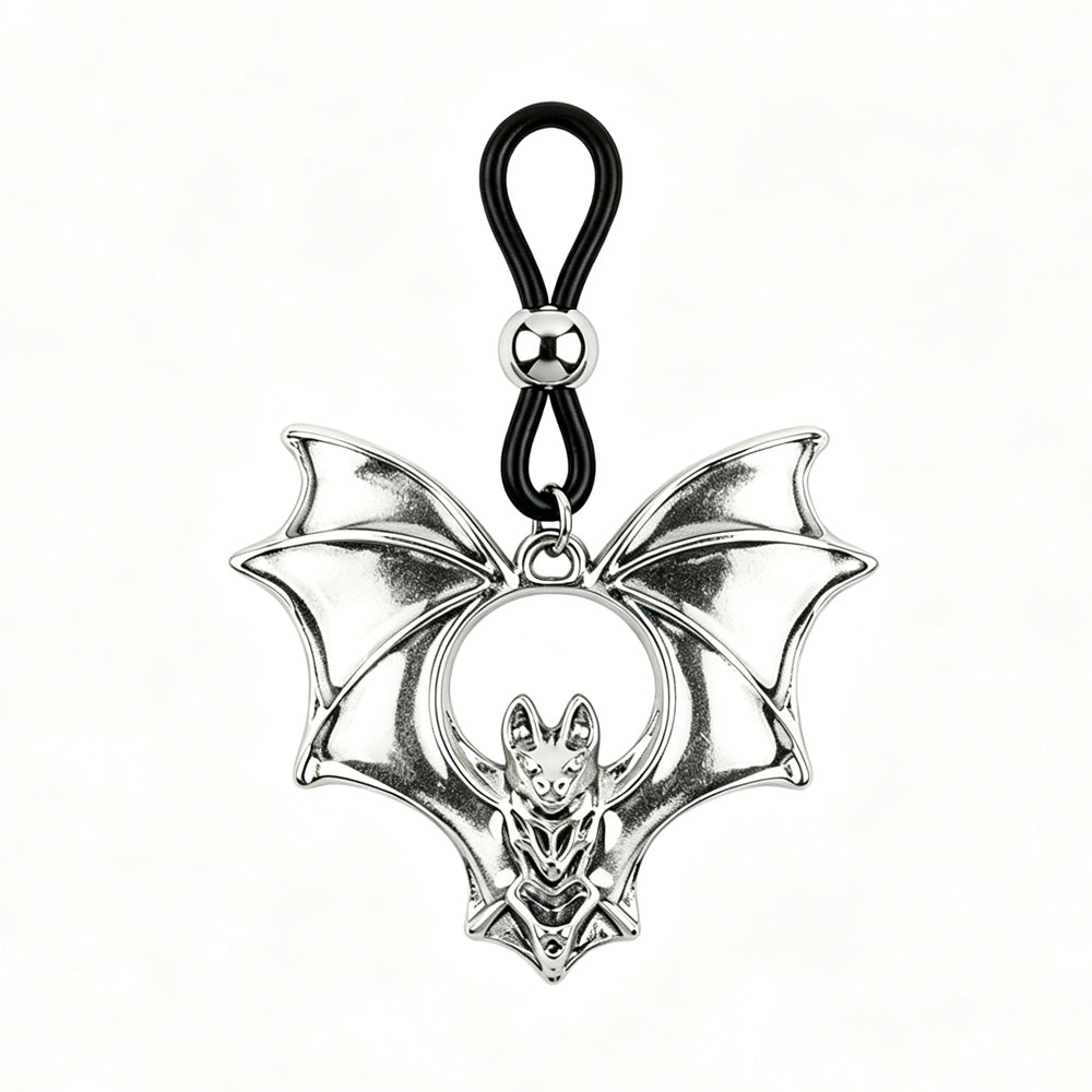 Close-up of a single antique silver gothic bat non-piercing nipple ring alternative body jewelry with adjustable black elastic loop, white background.
