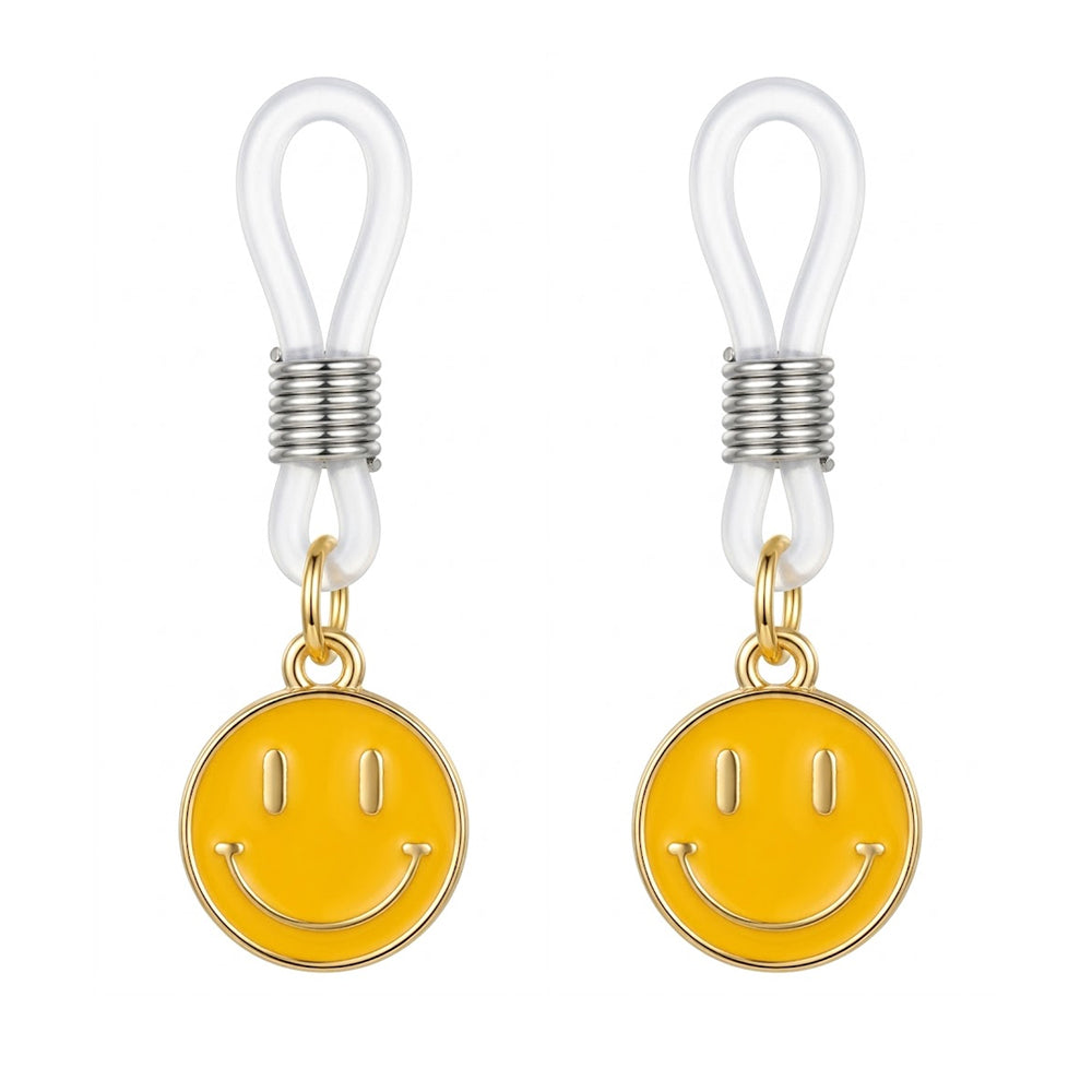 A pair of adjustable smiley face nipple clamps featuring tension-control sliders and yellow charms.