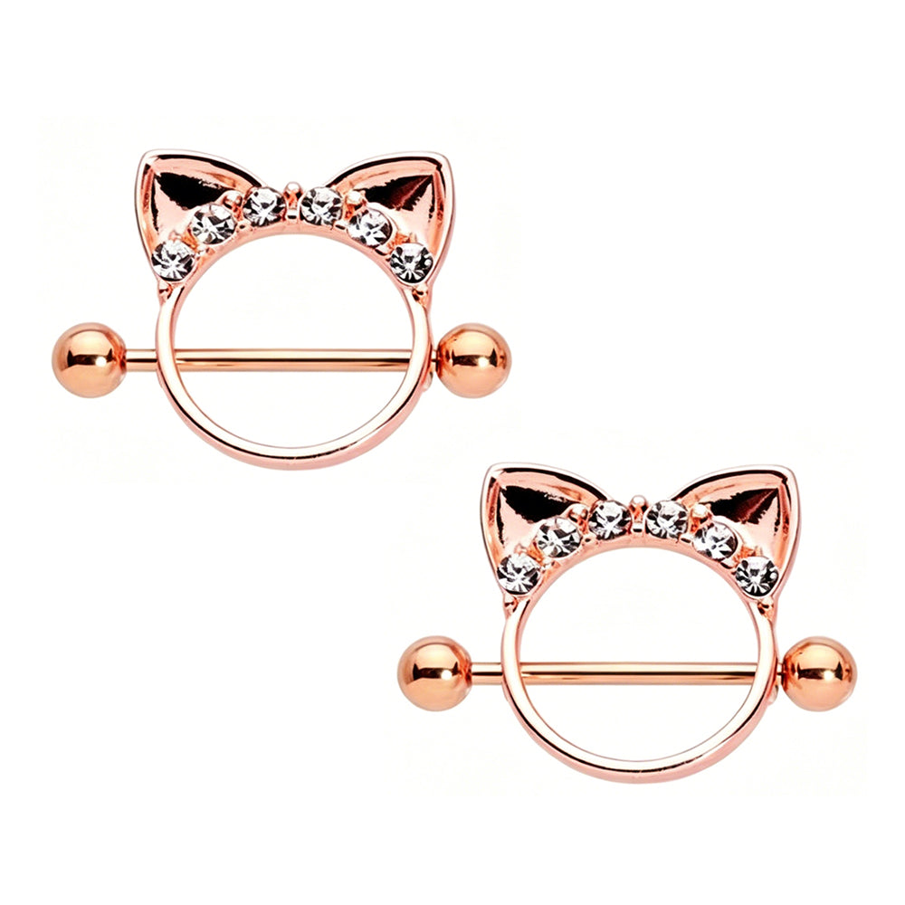 A pair of matching rose gold cat ear nipple shields with sparkling rhinestones for Coquette and Y2K aesthetic body jewelry