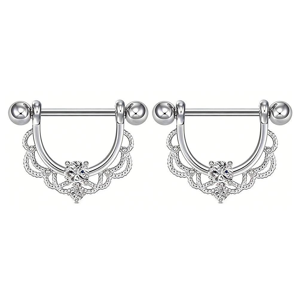 A pair of clear crystal lace nipple shields on a white background.