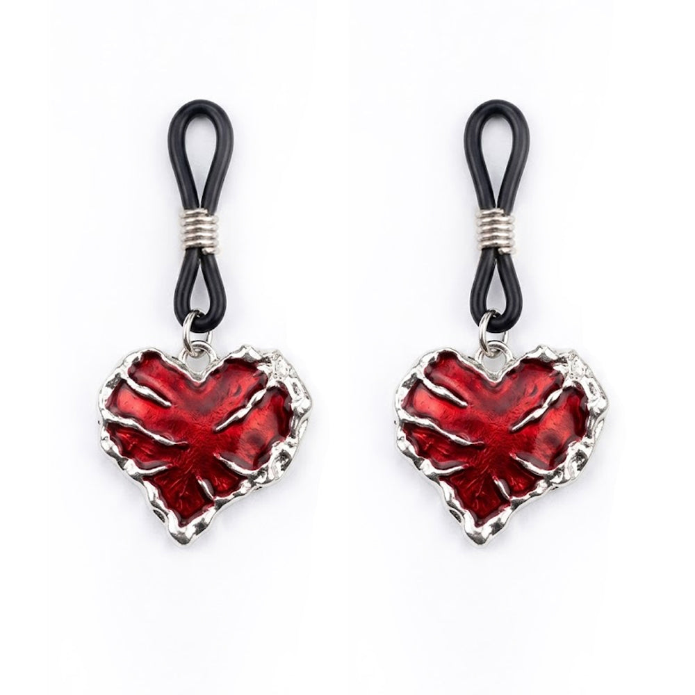 A pair of matching red bleeding heart charms for non-piercing nipple jewelry with adjustable black rubber sliders.