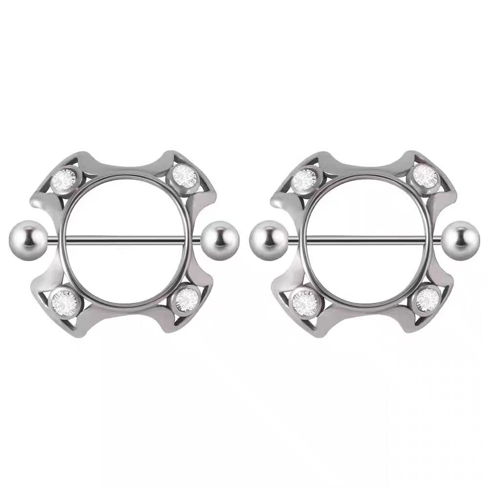 A matching pair of ornate silver-toned nipple shield rings with four crystal accents.