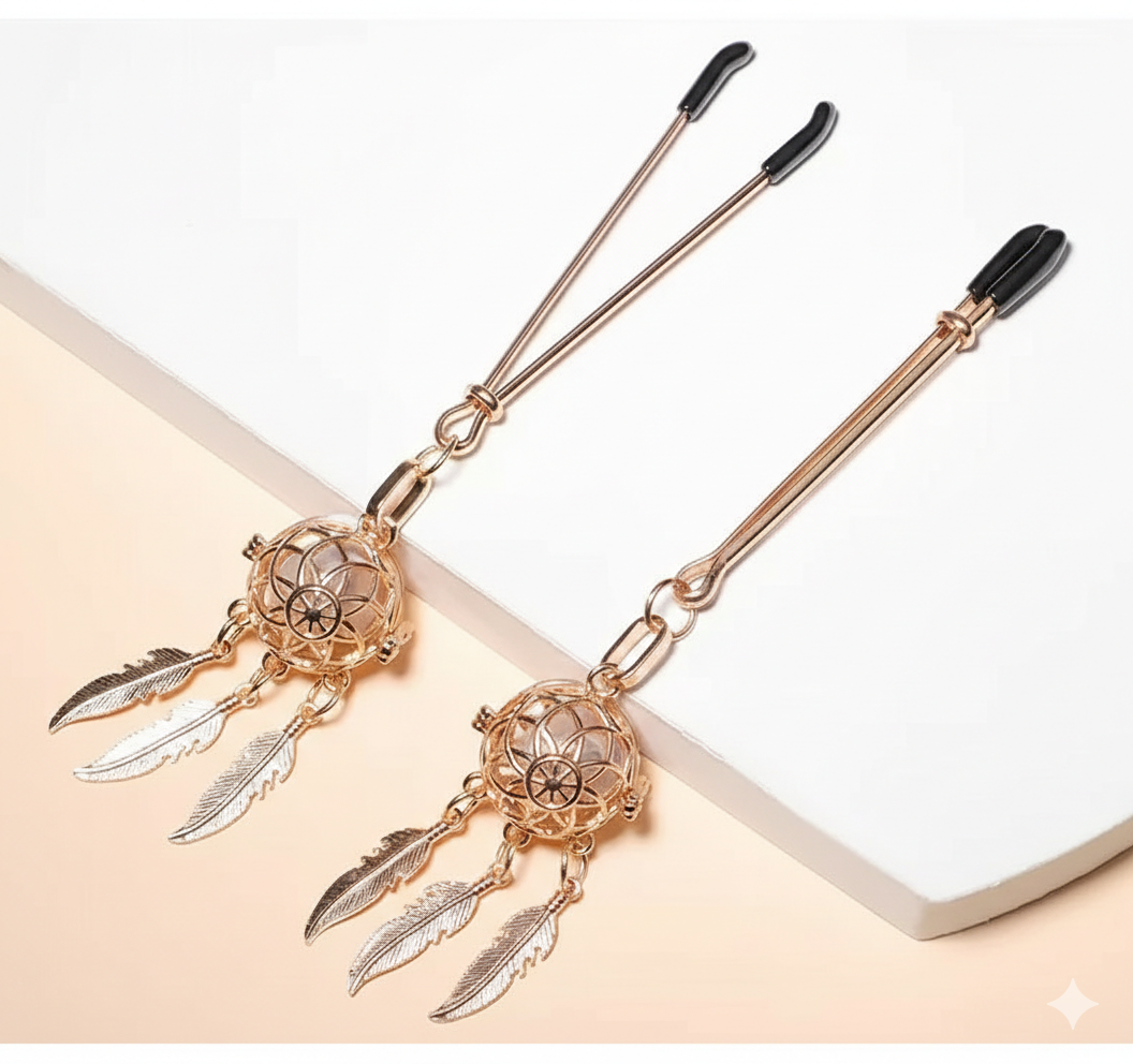 Pair of gold dreamcatcher non-piercing nipple clamps with feather dangles