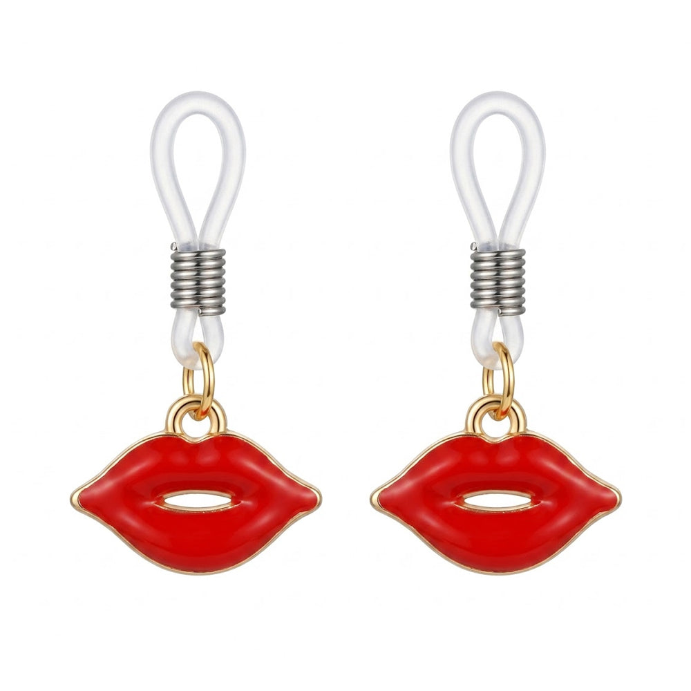 A pair of faux nipple piercing jewelry featuring glossy red lip pendants and clear adjustable loops