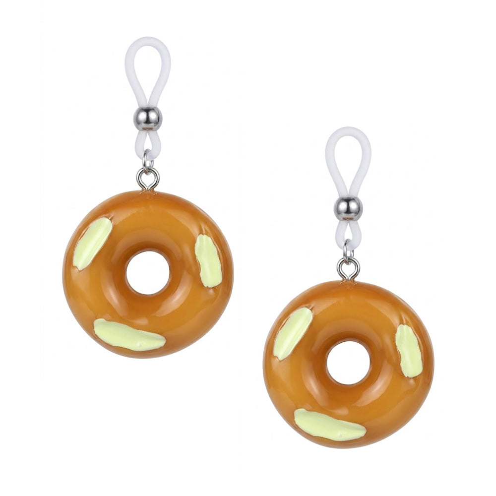 A pair of adjustable non-piercing nipple clamps featuring cute donut charms, perfect for Y2K style and alternative body accessories.