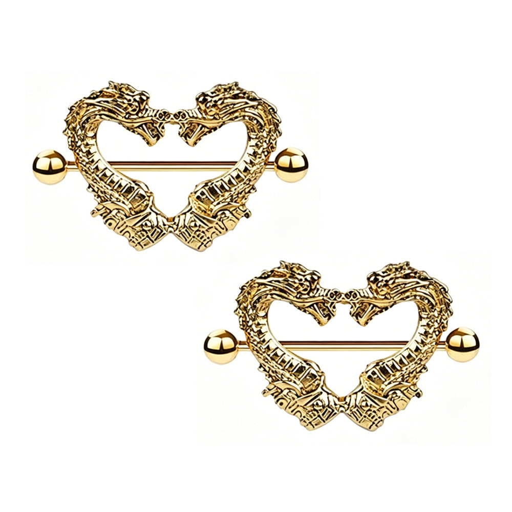 A matching pair of mythical dragon heart nipple shields on a clean white background.