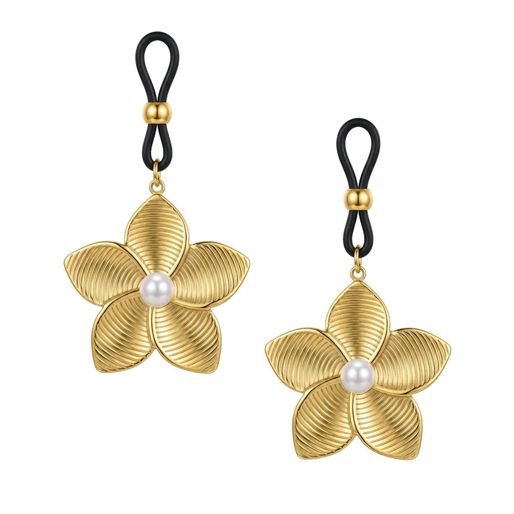 A pair of adjustable gold flower nipple loops featuring retro cottagecore styling and white pearl centers, styled for high-end alternative body jewelry shops.