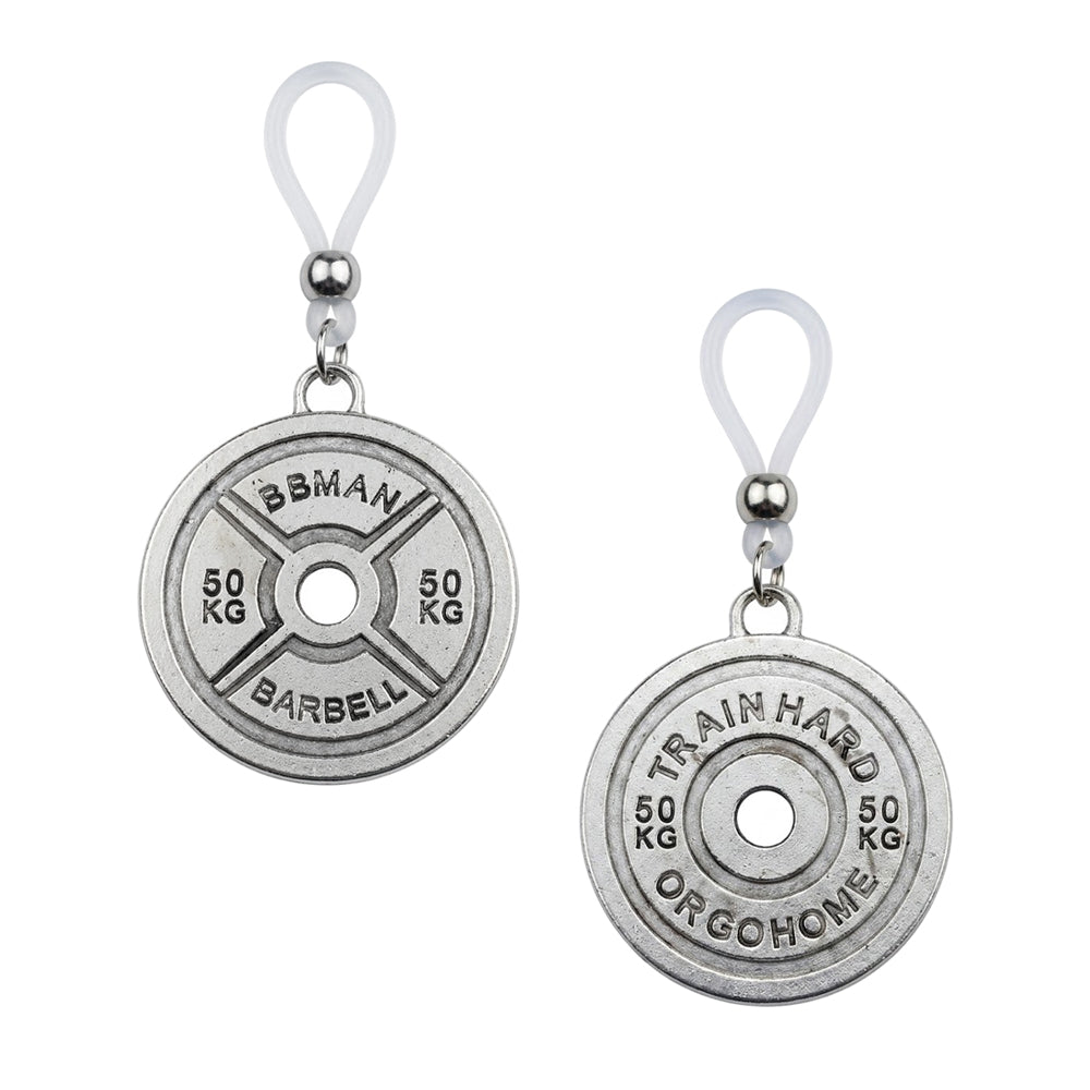A pair of gym culture non-pierced nipple loops showing weight plate designs with 'BBMAN BARBELL' and 'TRAIN HARD OR GO HOME' fitness motivational quotes.
