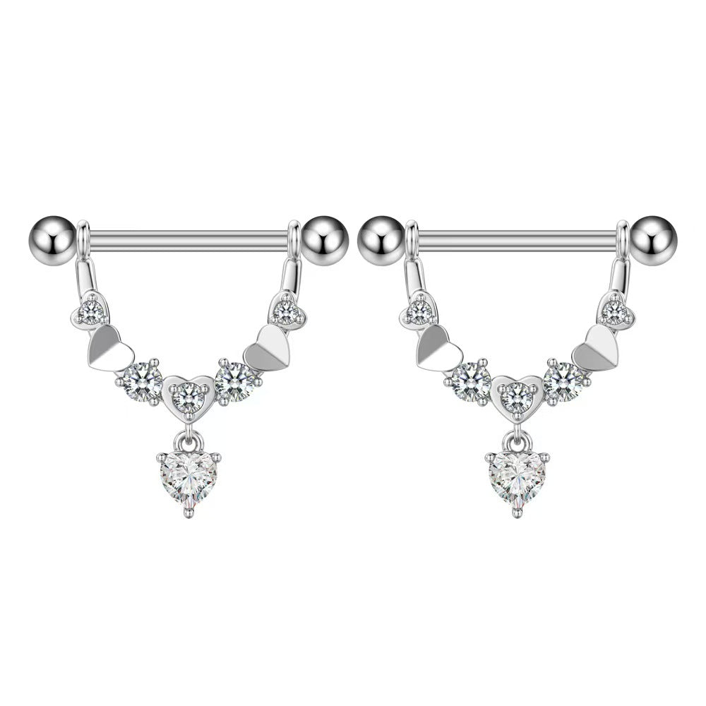 A matching pair of elegant crystal heart nipple shield barbells, ideal for a complete symmetrical body piercing look.