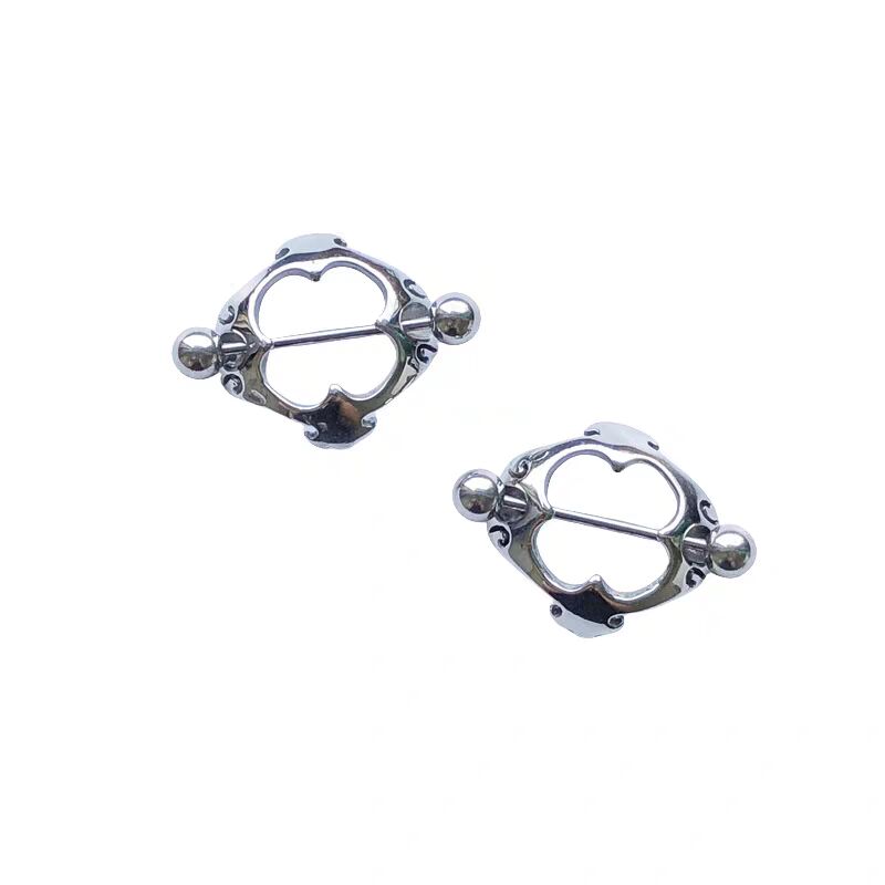 A pair of silver-toned decorative heart nipple shield rings with straight barbells.