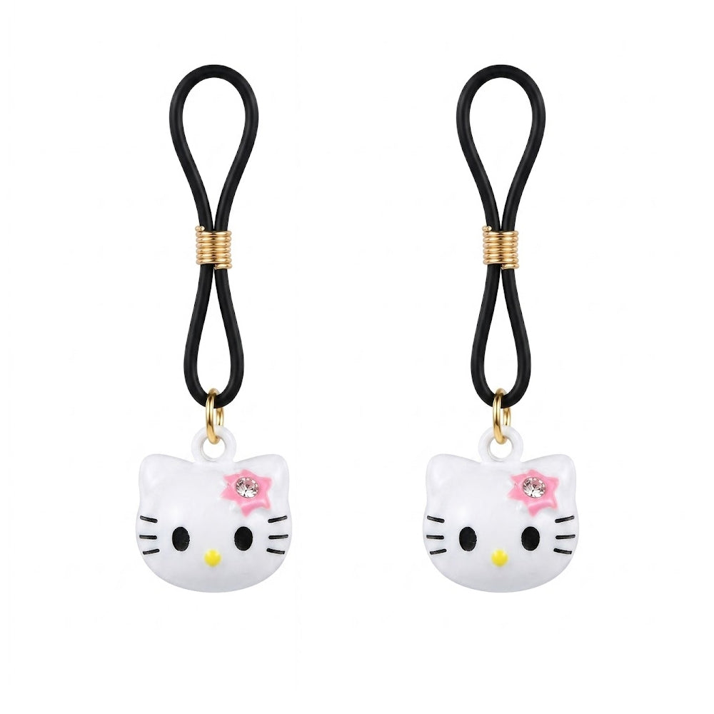 A pair of fake nipple piercing jewelry clamps featuring matching white cartoon cat charms with pink rhinestone accents and adjustable black body-safe silicone loops for pain-free non-pierced wear.