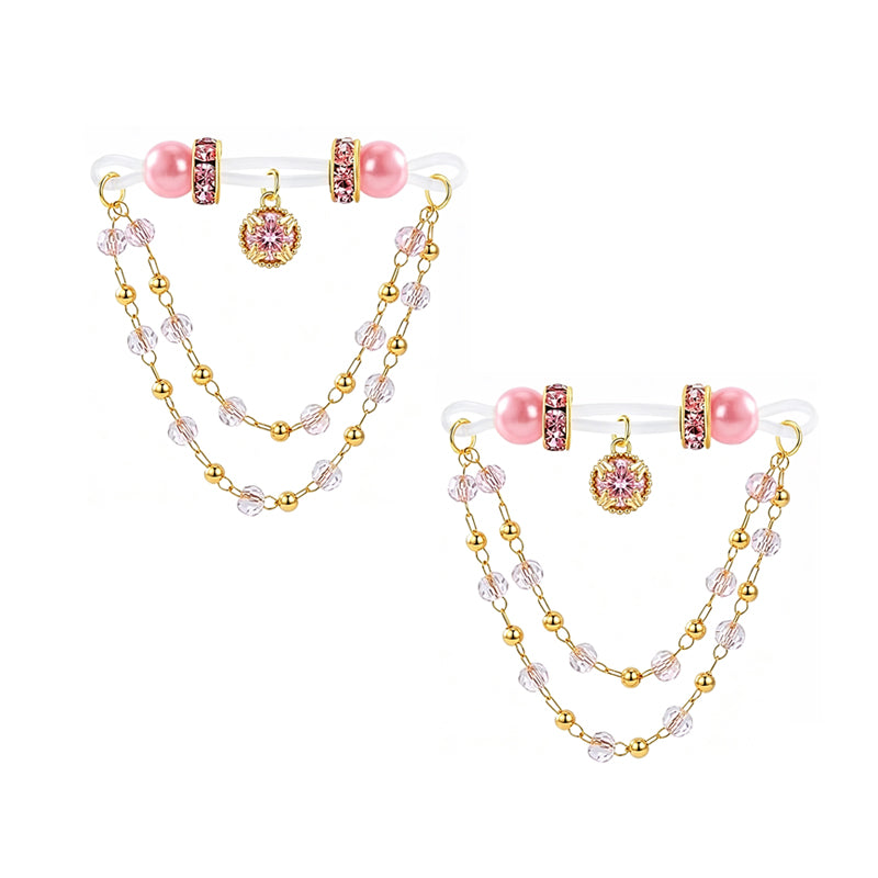 Pair of pink non-pierced nipple rings with crystal dangle chains set on a white background for body jewelry listings.