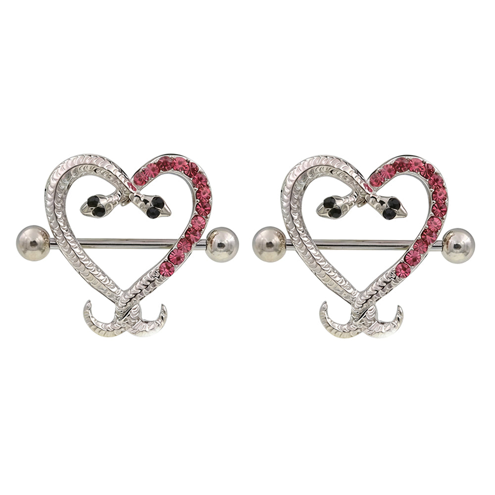 A matching pair of pink crystal snake heart nipple shields on white background.