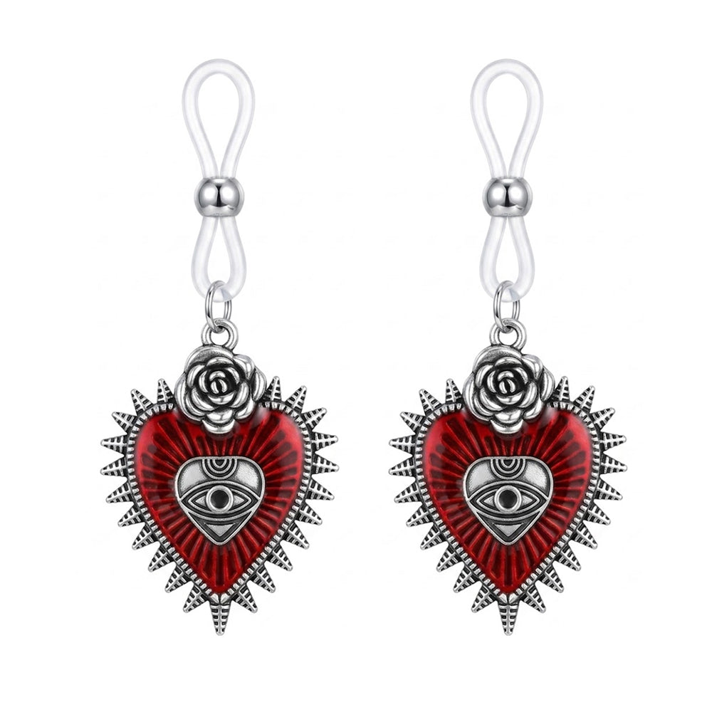 A pair of gothic red heart nipple rings with silver thorns, roses, and mystical eye symbols for alternative style.