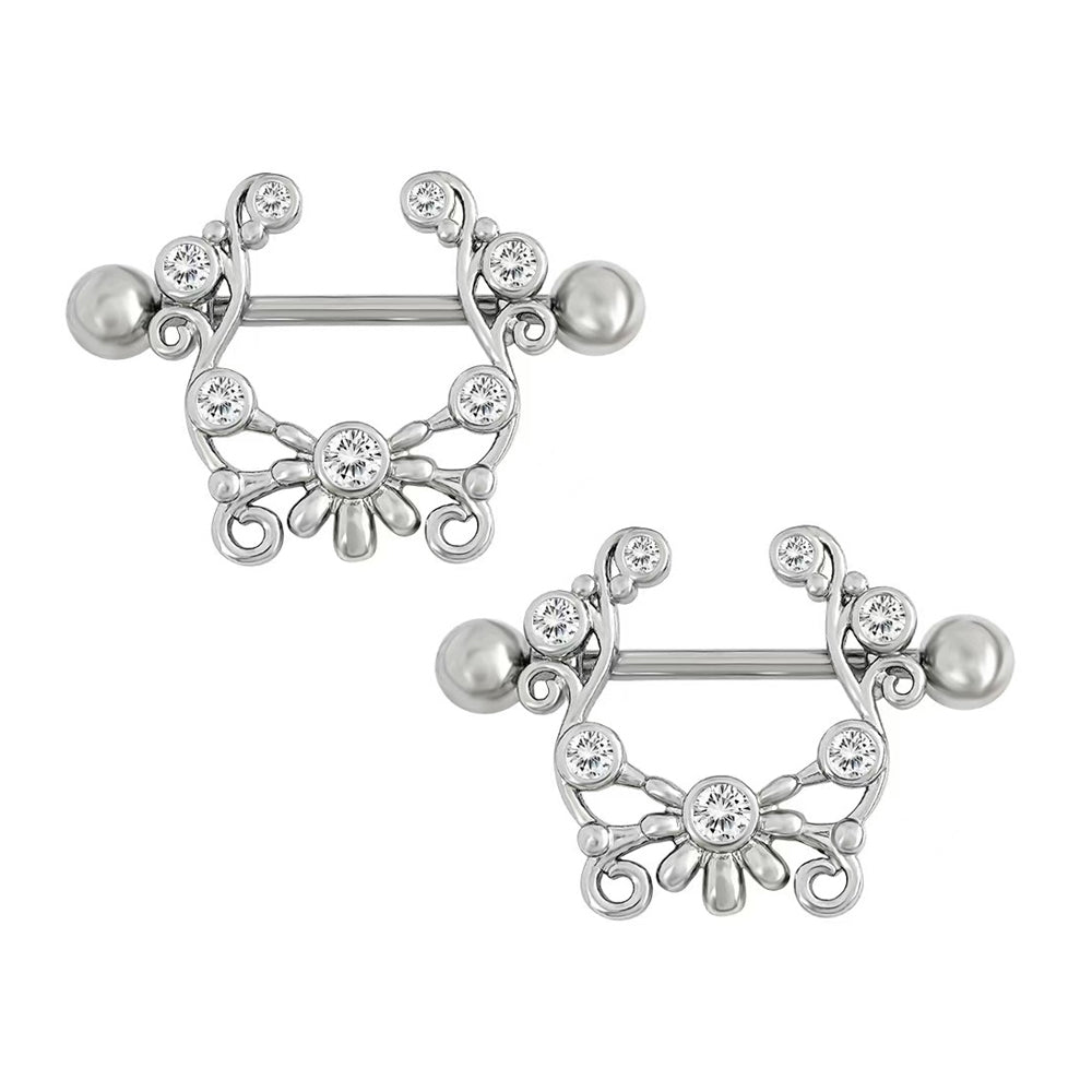 A matching pair of ornate vintage-style nipple shields for alternative fashion.