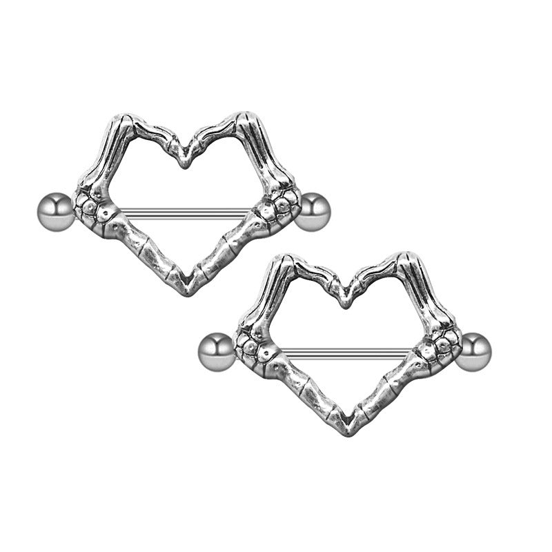 A matching pair of silver skeleton hand heart nipple shields with straight barbells, perfect for a coordinated gothic body piercing look.