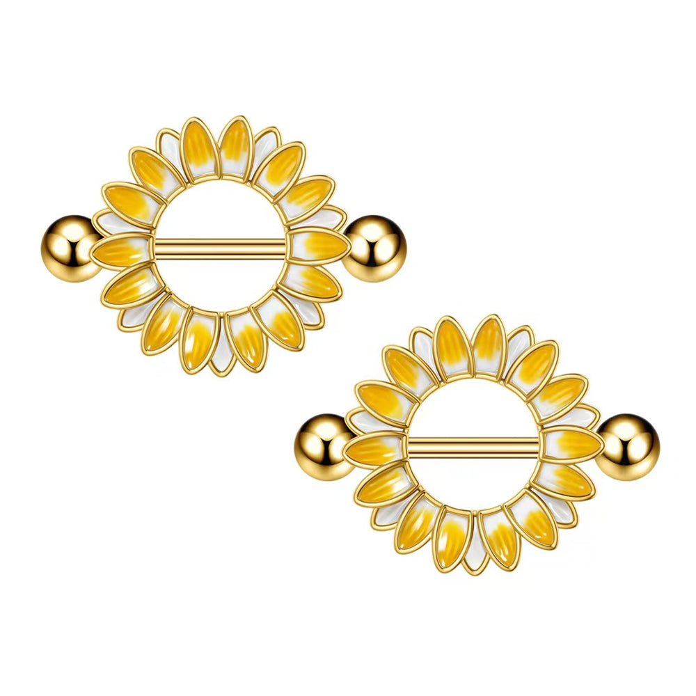 A pair of golden sunflower nipple shields showcasing symmetrical floral design.