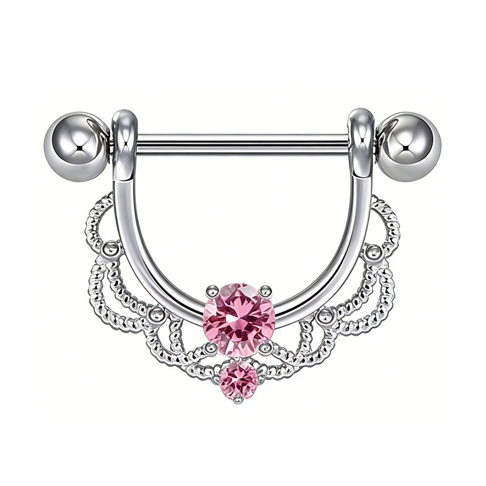 Ornate nipple shield jewelry featuring a bright pink gemstone.
