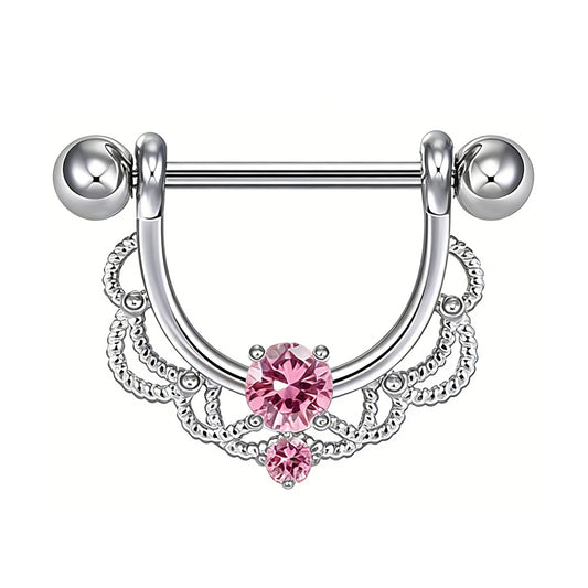 Ornate nipple shield jewelry featuring a bright pink gemstone.
