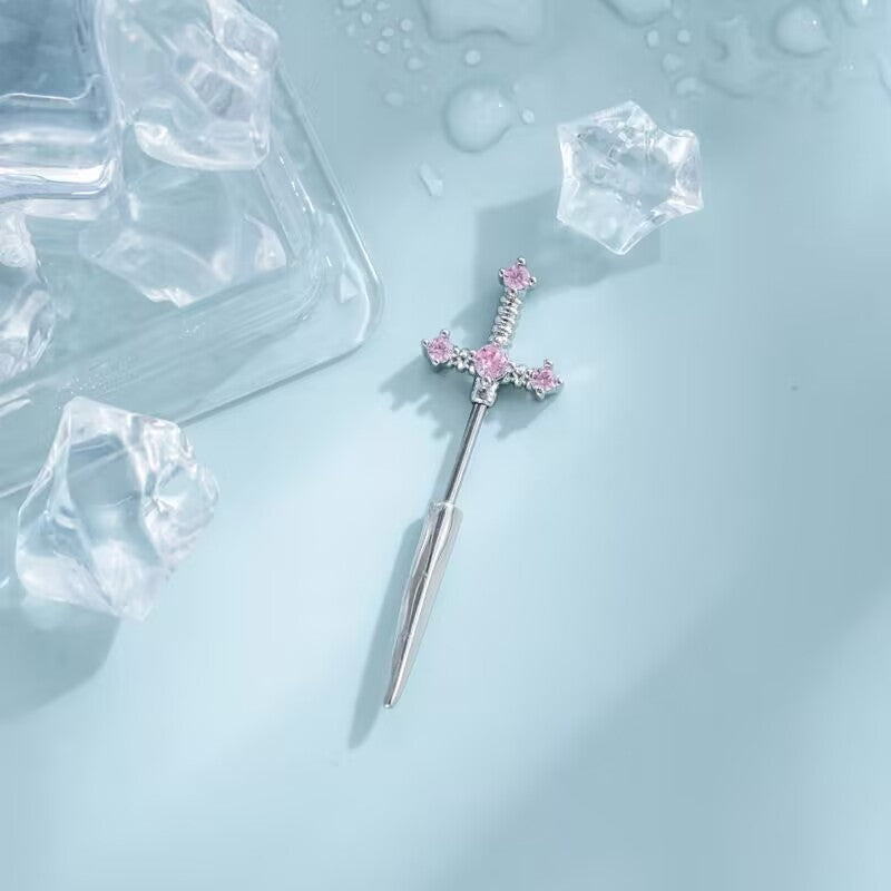 Silver sword stud earring with princess pink zircon gems for coquette gothic jewelry styling.