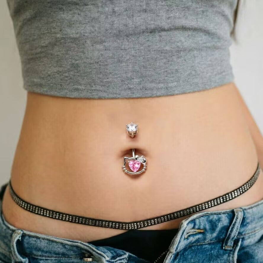Pink heart kitty navel ring worn on model with G23 titanium belly piercing jewelry