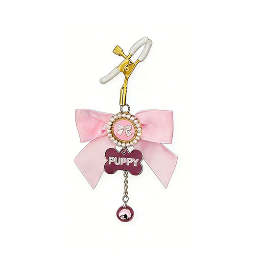 Single pink puppy play nipple clamp with a pearl-encrusted charm and bone-shaped tag.